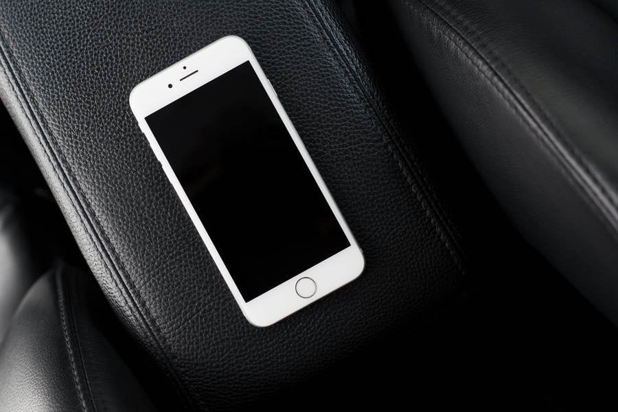 Directly from Above View of a Cell Phone on a Center Console in a Car