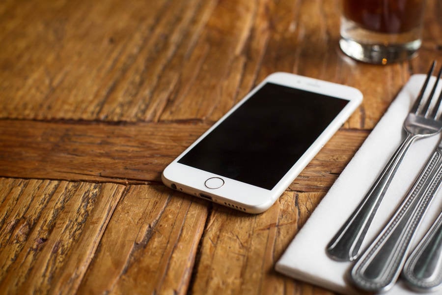 Low- Angle View of a Cell Phone on a Restaurant Table
