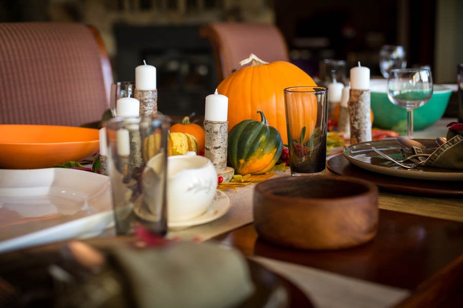 Thanksgiving Table Setting with Candles and Pumpkins