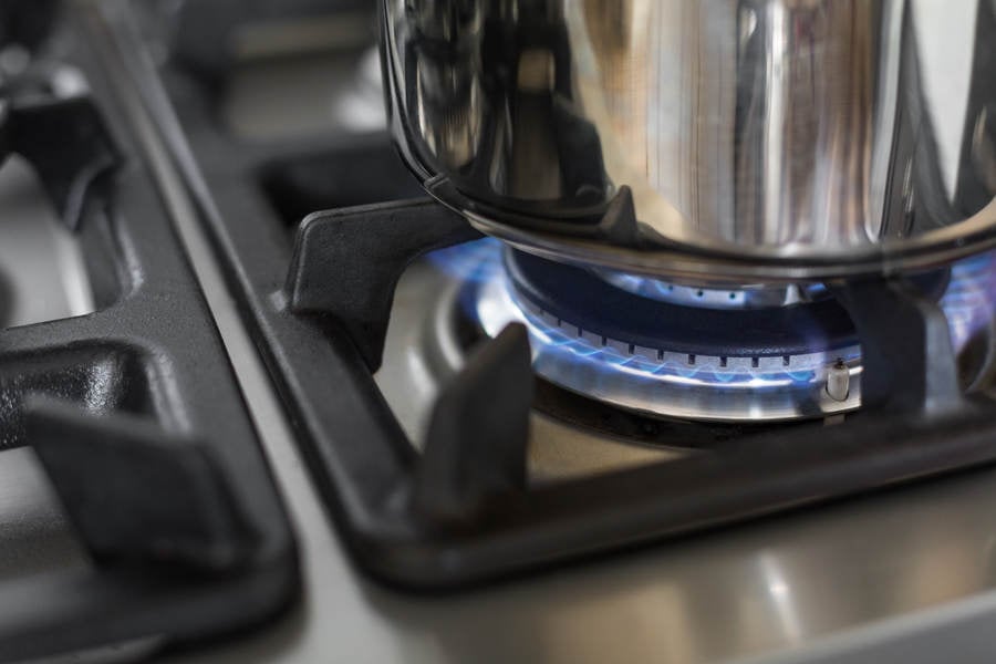Detailed View of a Stainless Steel Pot on a Gas Stove