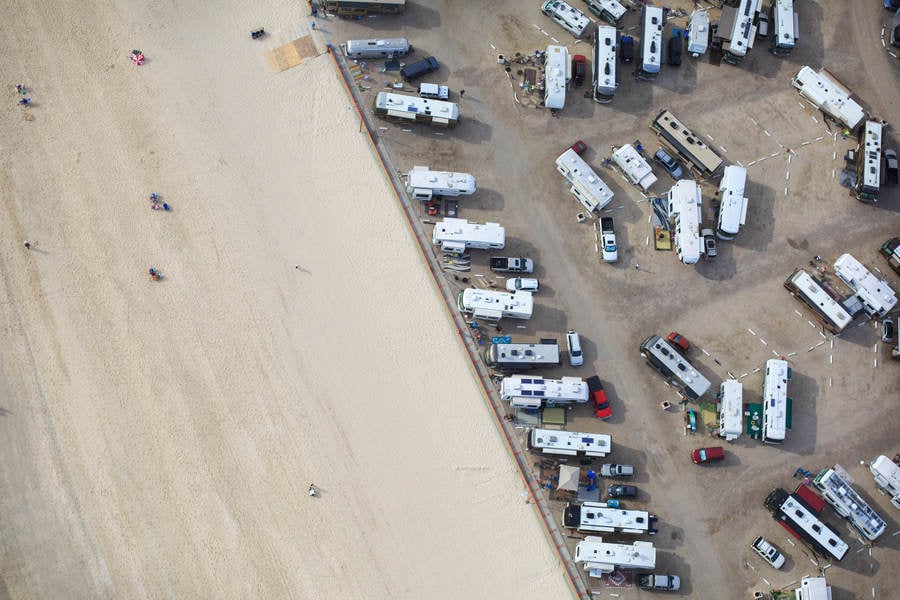 Aerial View of a Beach and a Campground with Motorhomes
