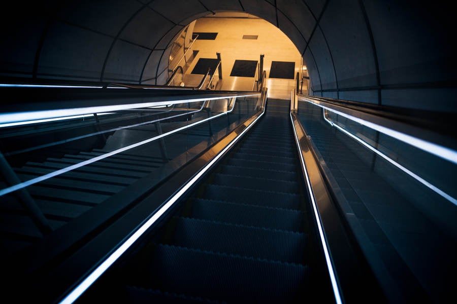 View down the Escalator Leading to a Subway Station