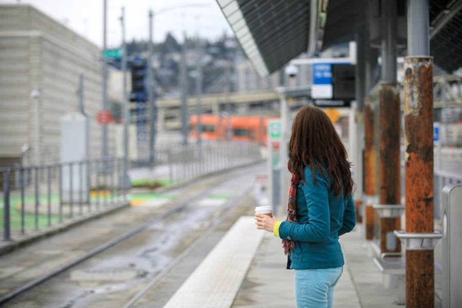 Detailed View of a Woman on a Platform Expecting Arrival of a Train