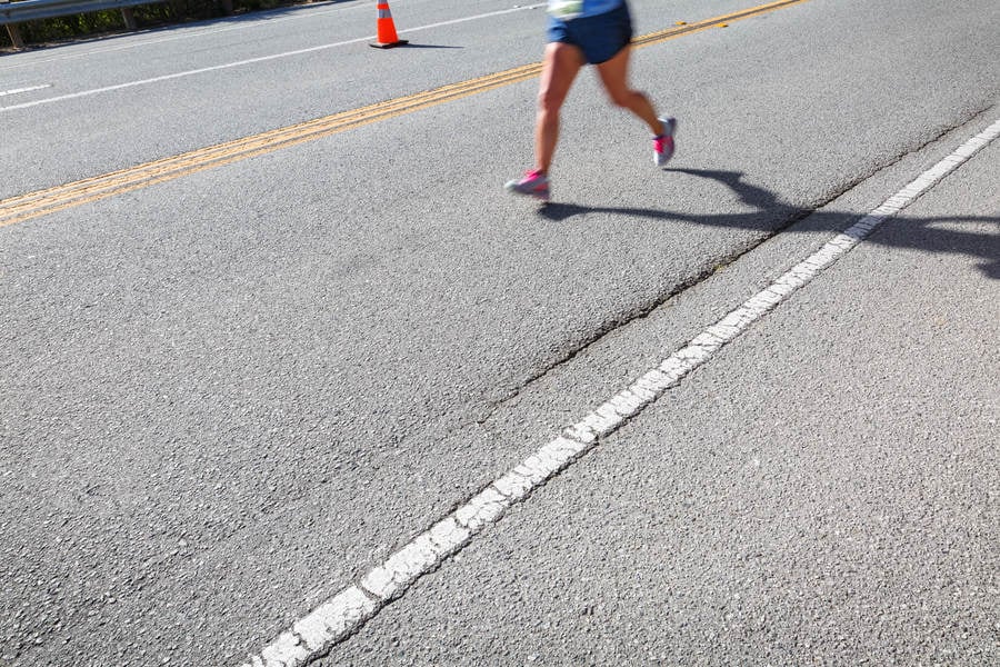 Lower Portion of a Runner on the Road