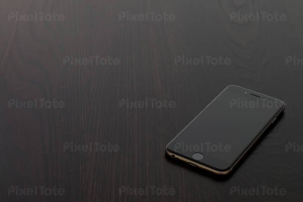 Detailed View of a Cell Phone on a Black Table