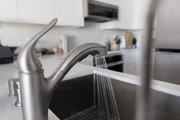 Faucet With Running Water in a Modern Kitchen