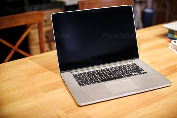 View of a Laptop on a Wooden Table
