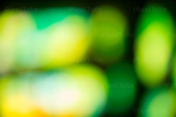Out-of-Focus Abstract Green and Yellow Bokeh Lights