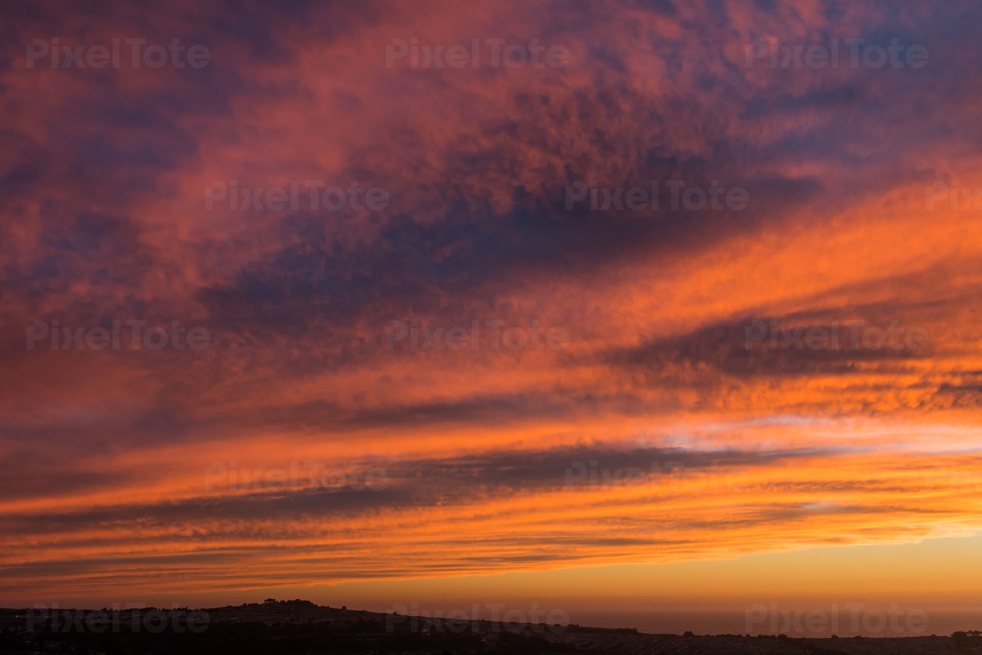 Dramatic Sunset Sky With Clouds Grouped Above The Horizon Stock Photo Pixeltote