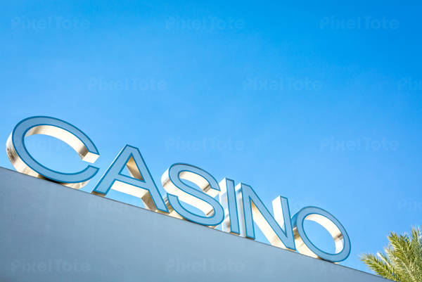 View of a Casino Sign Against a Blue Sky