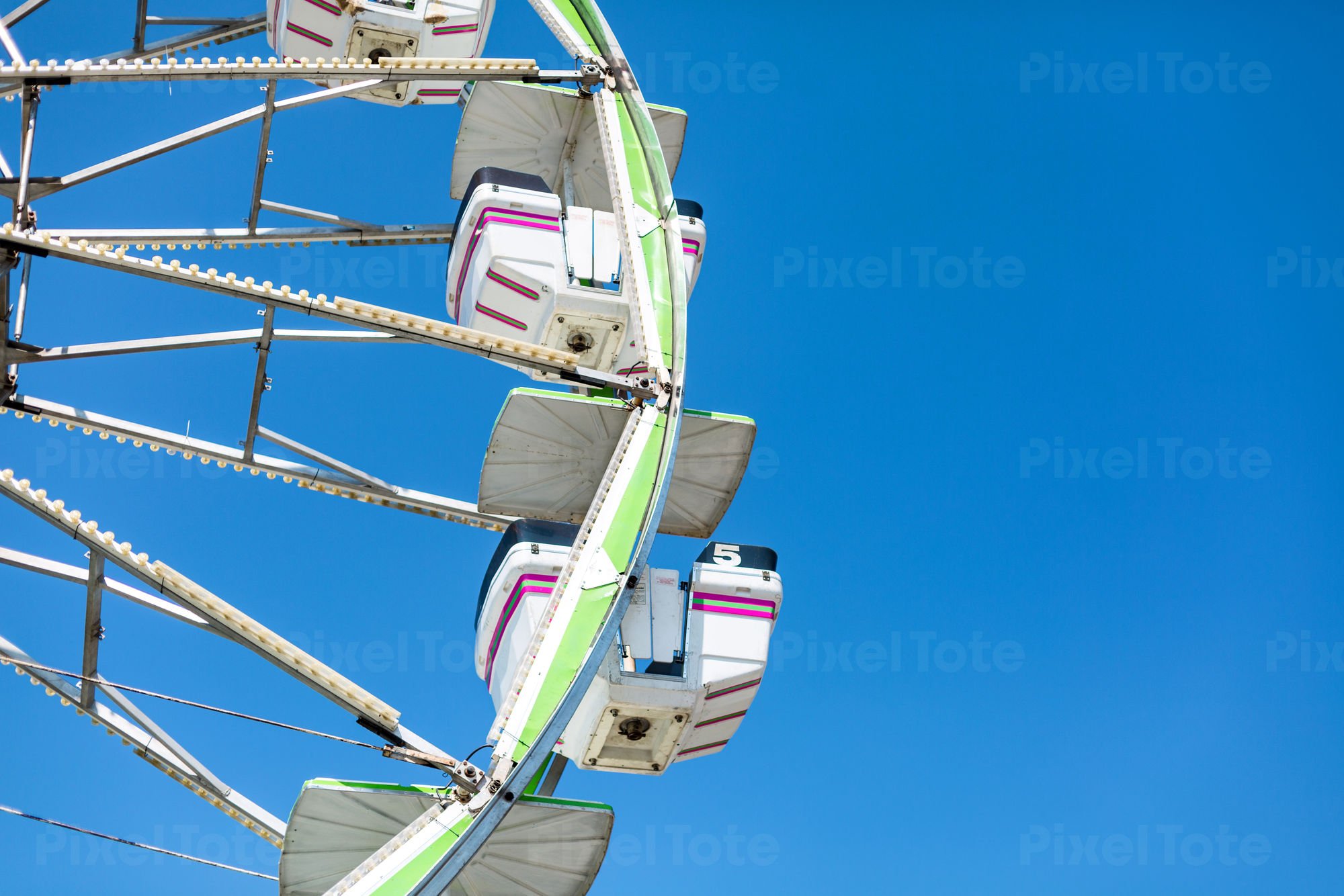 Low Angle View Of A Ferris Wheel Against The Blue Sky Stock Photo Pixeltote