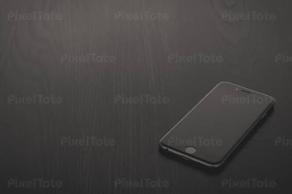 Detailed View of a Cell Phone on a Black Table