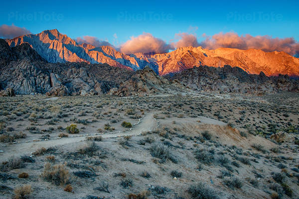Sunrise in the Desert with High Mountains in the Background