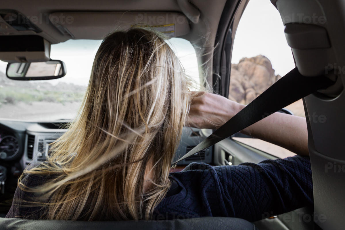 Rear View Of A Woman In A Car Stock Photo Pixeltote