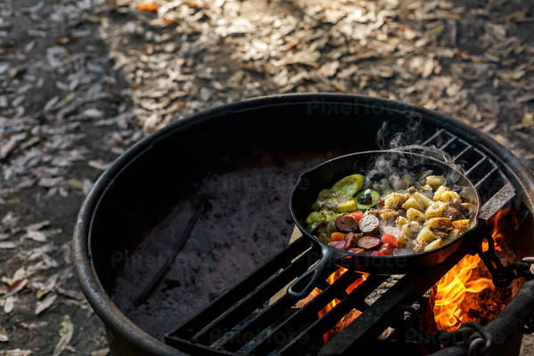 Breakfast Cooking in a Skillet over an Open Fire