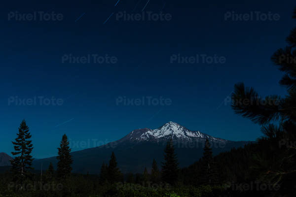 View of a Mountain at Night with Starry Sky