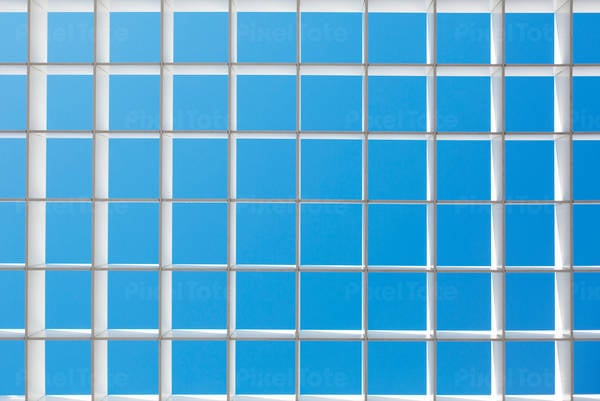 Full-Frame Shot of a Ceiling Grid Against the Blue Sky