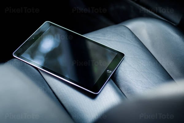 View of a Digital Tablet on a Front Car Seat