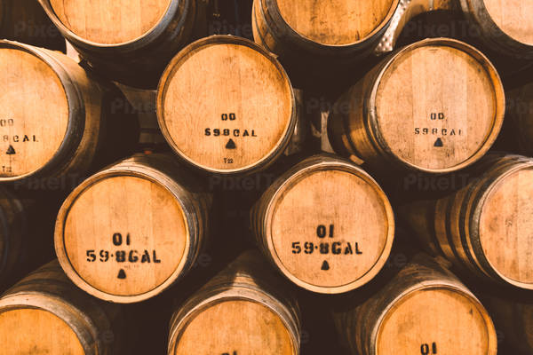 Front View of Wine Barrels Stacked in a Wine Cellar