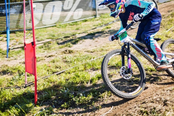 Blurred Motion of a Mountain Biker Competing in a Downhill Race