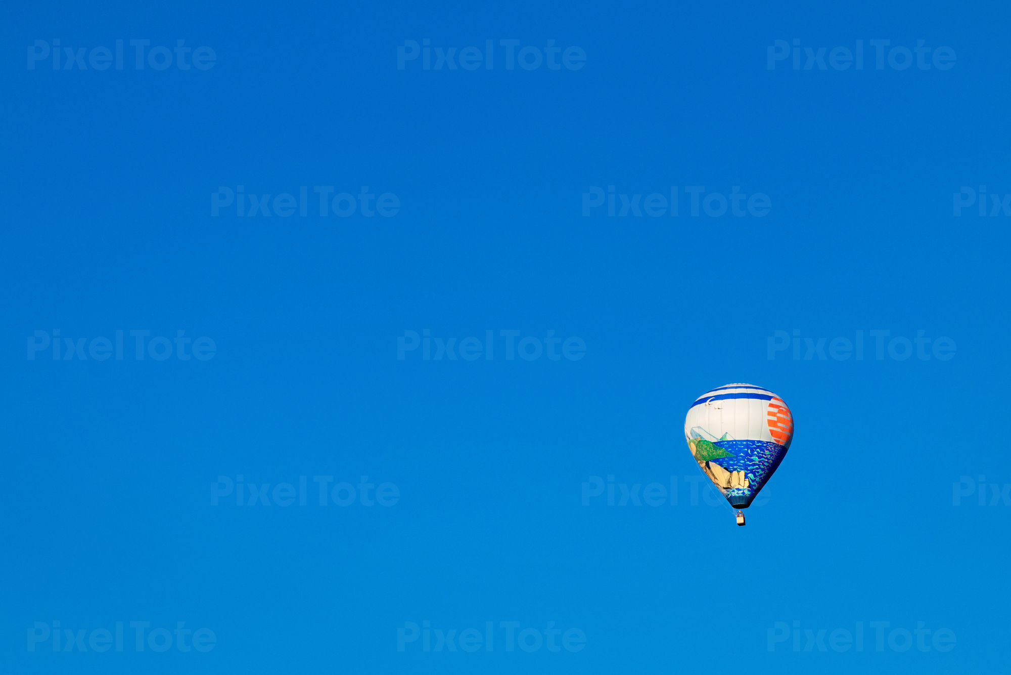 Hot Air Balloon And A Clear Blue Sky Behind Stock Photo Pixeltote