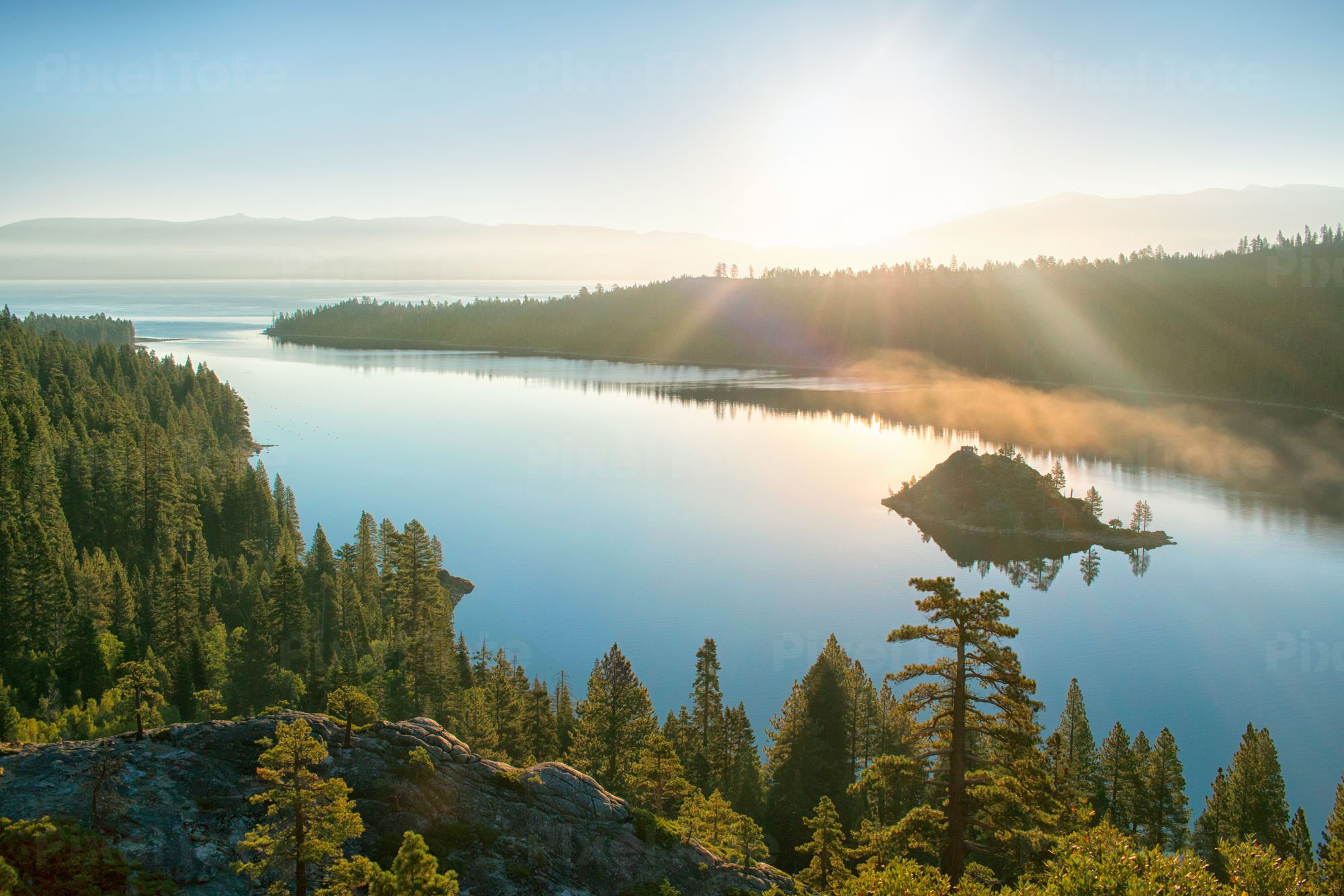 Morning Sun Shining over a Calm Stock Photo - PixelTote