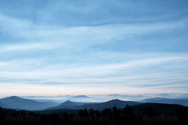 Cloudy Evening Sky in Blue Tones with Mountain Peaks Vistas
