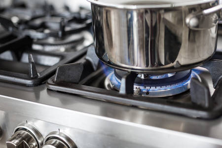 Close-Up of a Stainless Steel Pot on a Gas Stove