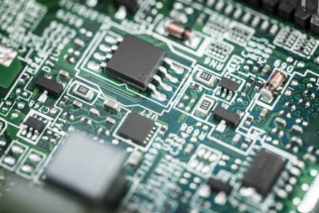 Close-Up View of a Green Circuit Board with Multiple Small Resistors