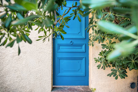 Blue Door with a Knocker in a Small Town in Southern France