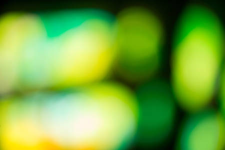 Out-of-Focus Abstract Green and Yellow Bokeh Lights