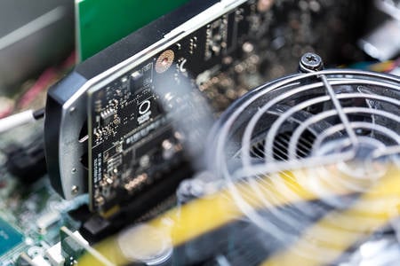 Close-Up View of a Circuit Board with a CPU Fan 
