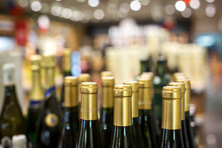 Close-Up of Neatly Arranged Wine Bottles in a Retail Store