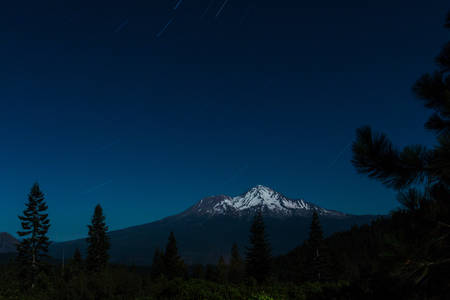 View of a Mountain at Night with Starry Sky