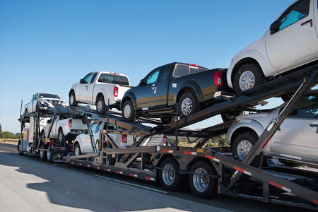 View of Pickups Being Transported on an Auto Delivery Truck
