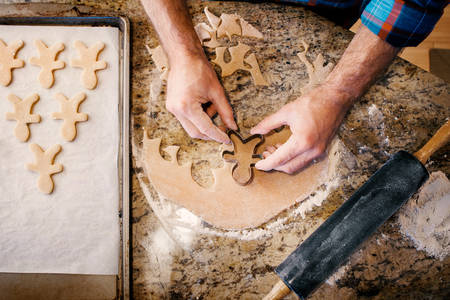 Overhead Shot of a Man Baking Gingerbread Cookies at Home